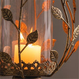 Candelabro hojas dorado