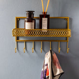 Repisa perchero dorada