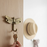 Percha libélula dorada